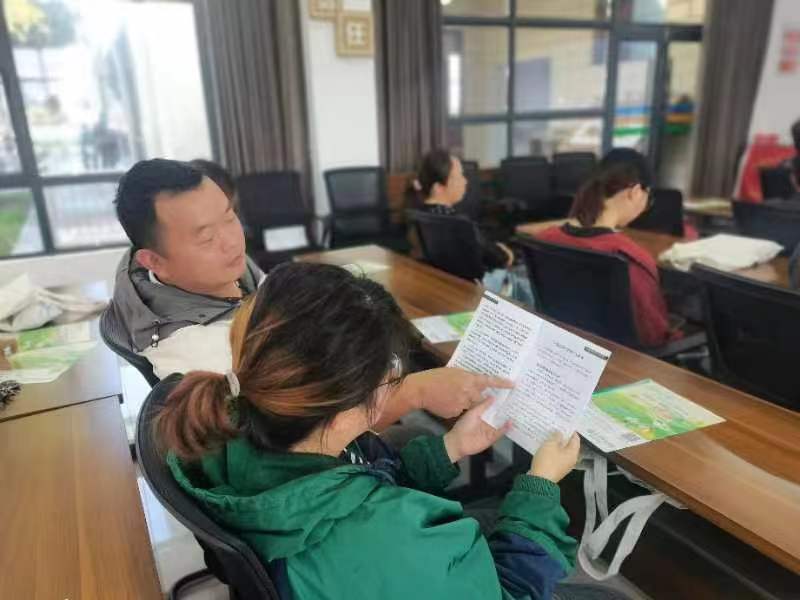 丹洲乡明月社区开展“提高法律意识 警惕非法集资”宣传活动